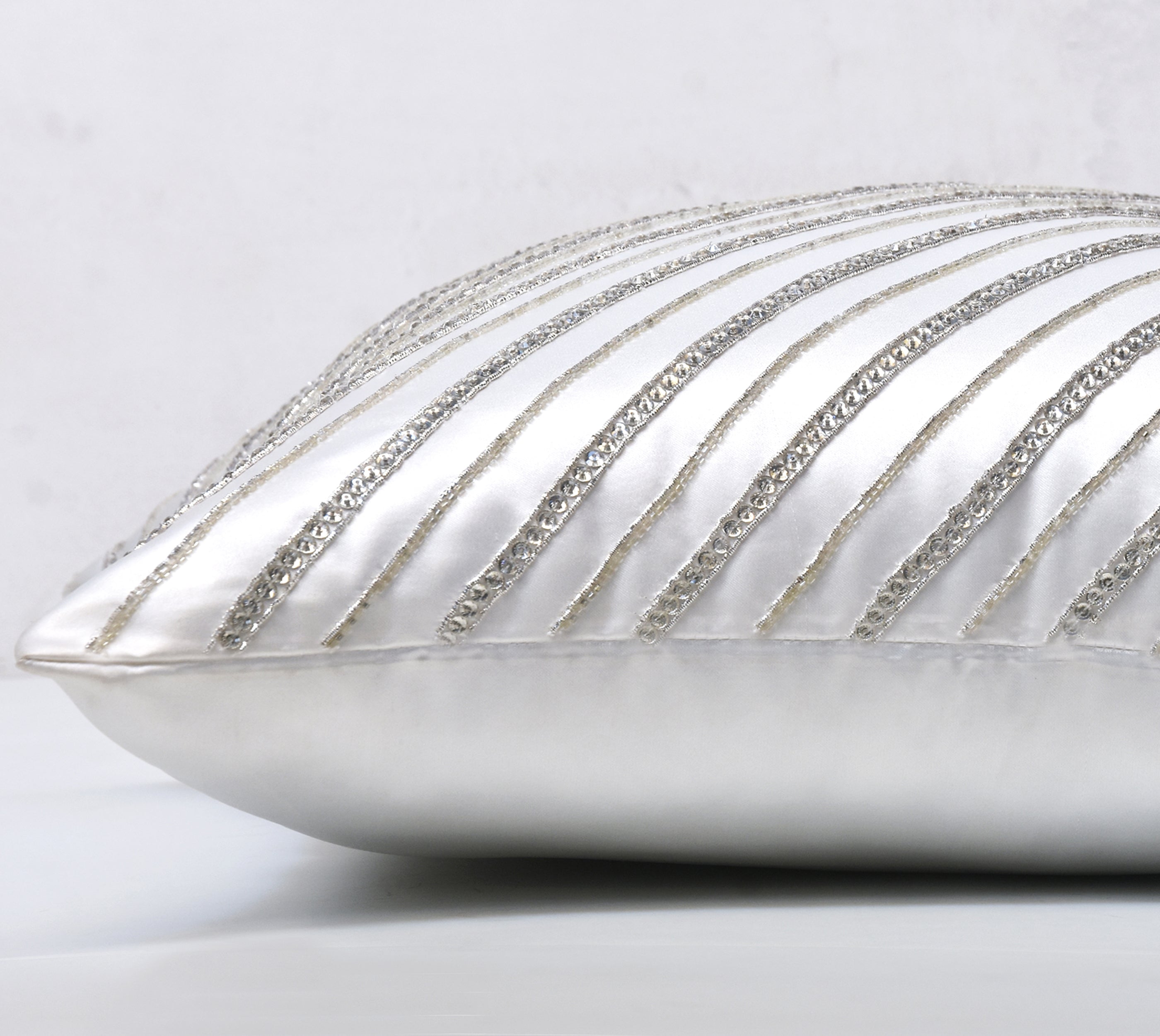 silver and white decorative pillows